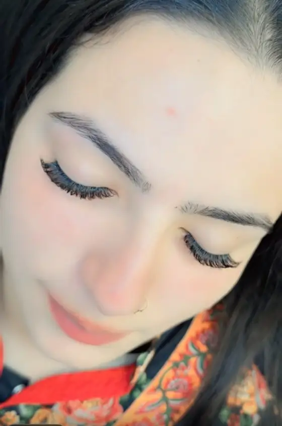Client looking down showing fluffy lash extensions