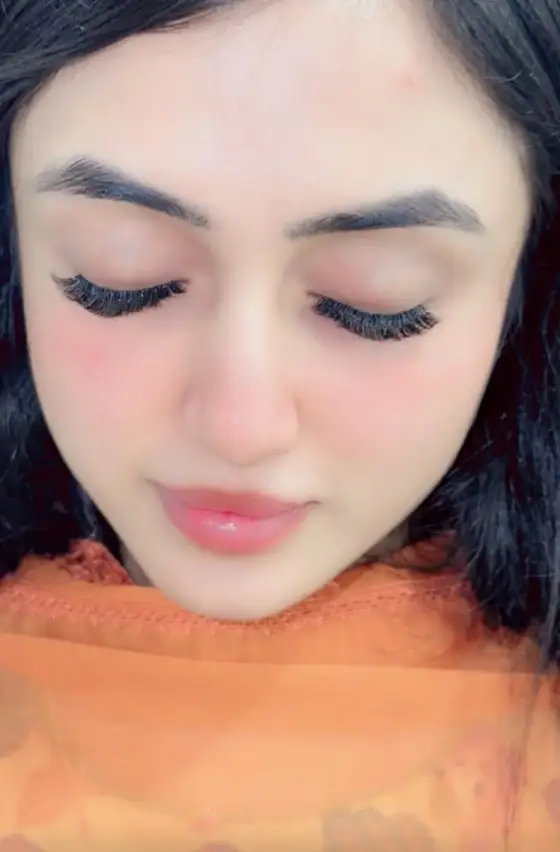 Close-up of full volume lash extensions with eyes closed