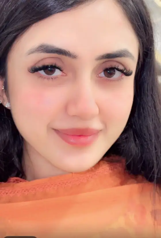 Smiling client wearing a soft volume lash set