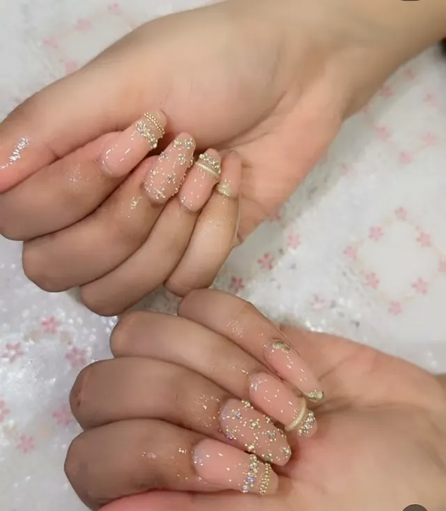 Nude coffin nails with gold beads and crystals